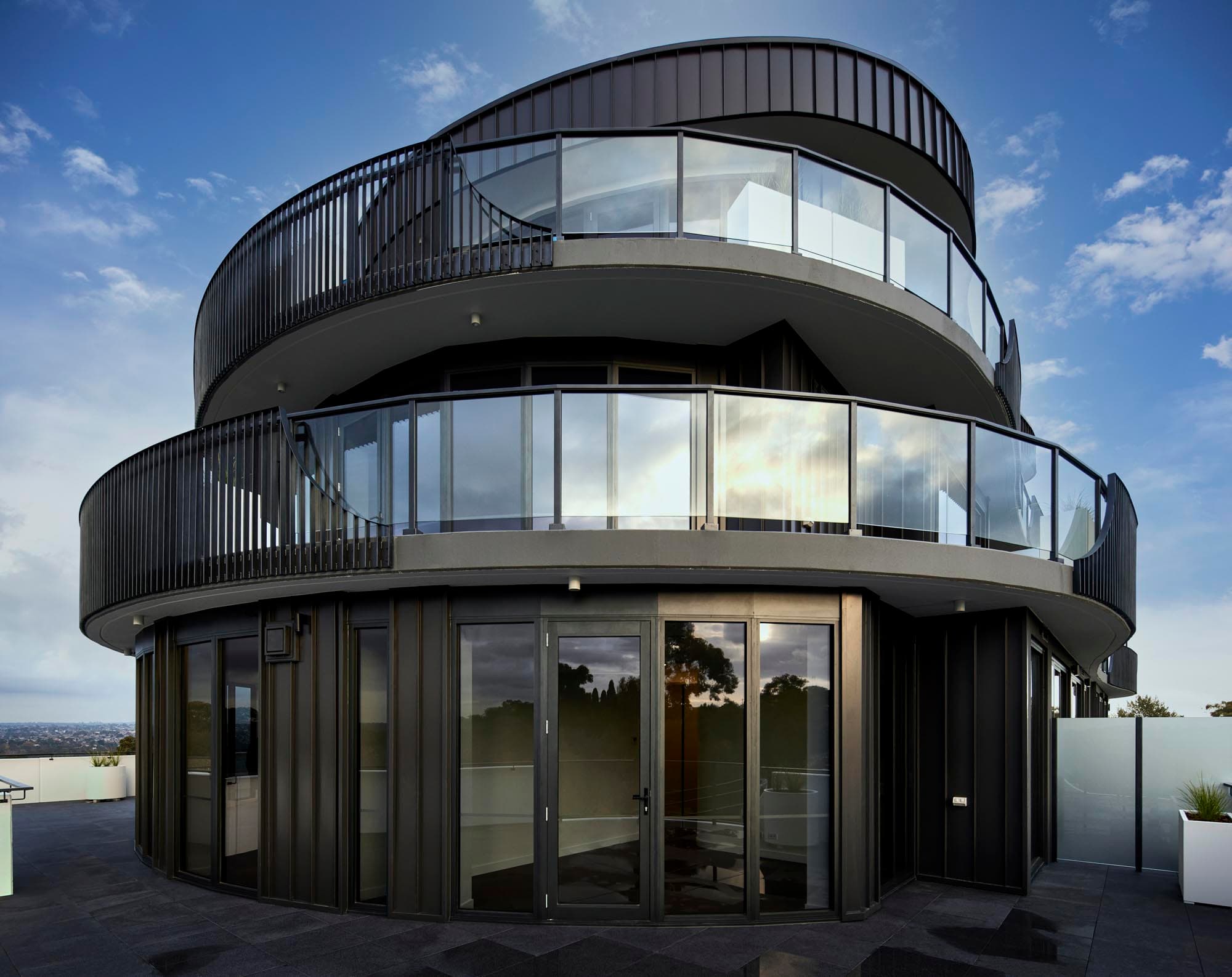 Curved Modolux balustrade systems on a contemporary residential building