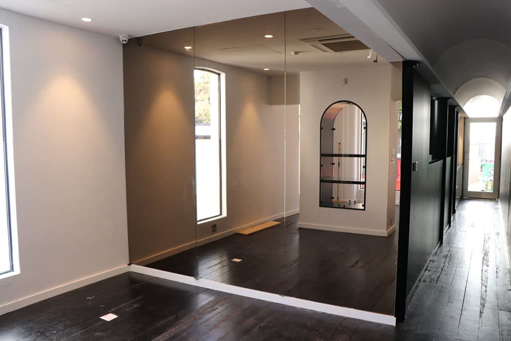 Large bronze architectural mirror in a residential interior